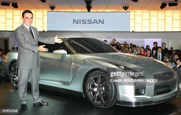 Carlos Ghosn, president of Japan's Nissan Motor Co., introduces its concept car "GT-R PROTO" to be launched worldwide in 2007, during a press preview...