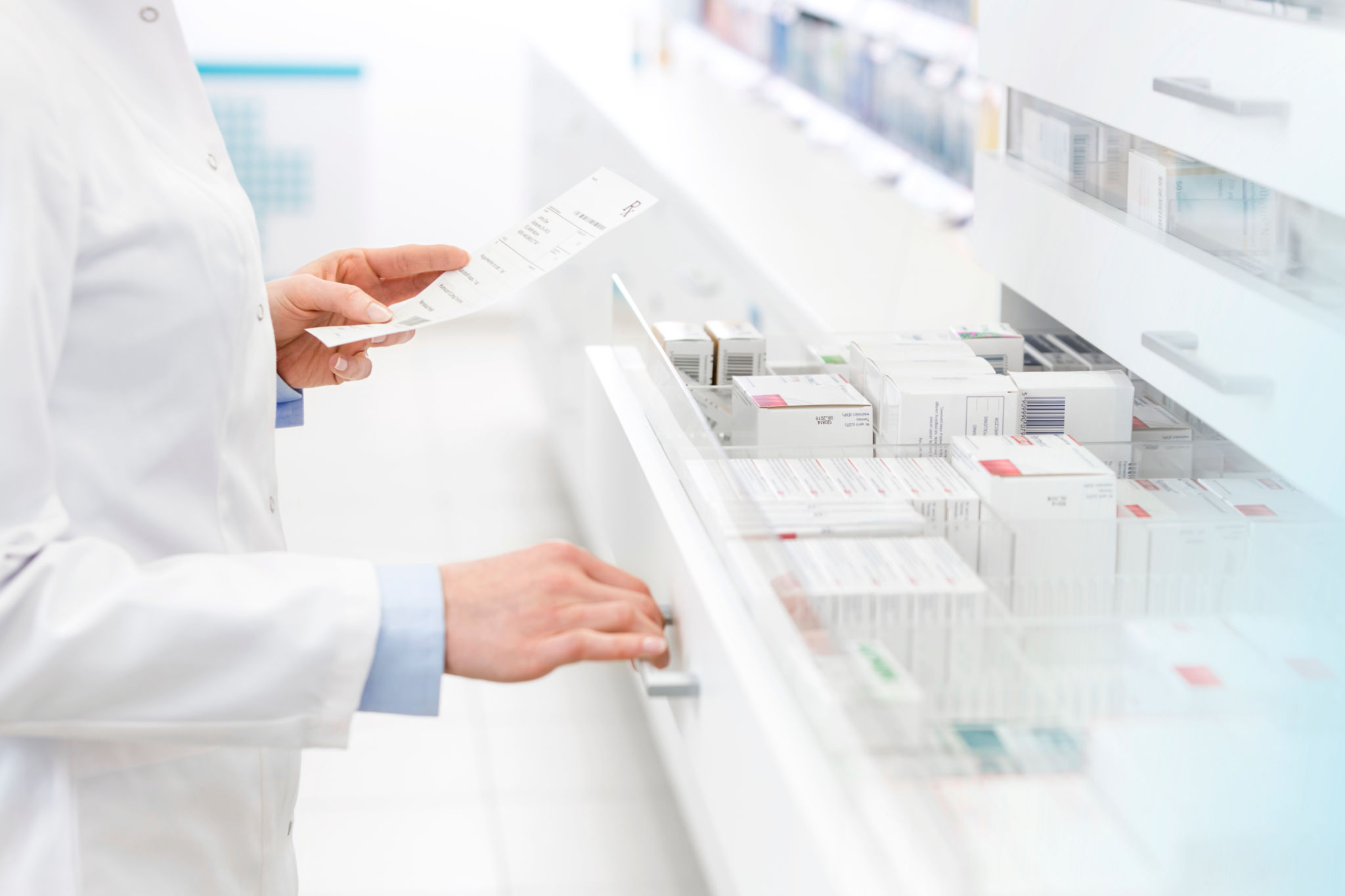 pharmacist reviewing prescriptions