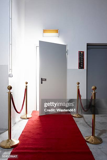 red carpet in front of open door - red carpet entrance stock pictures, royalty-free photos & images