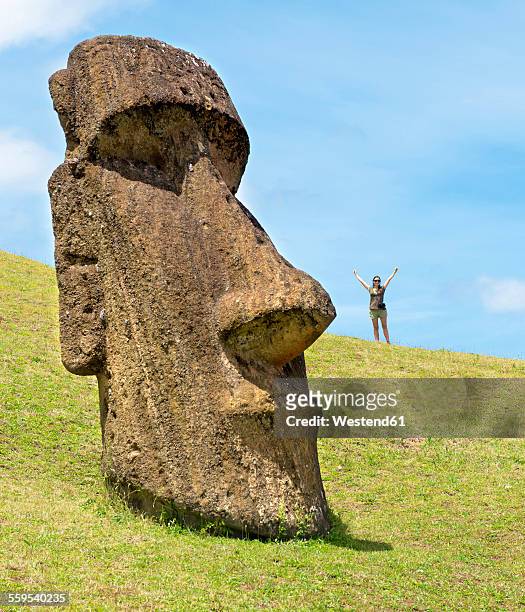 chile, easter island, woman with moai in ranu raraku quarry, in the rapa nui national park - head sculpture stock pictures, royalty-free photos & images