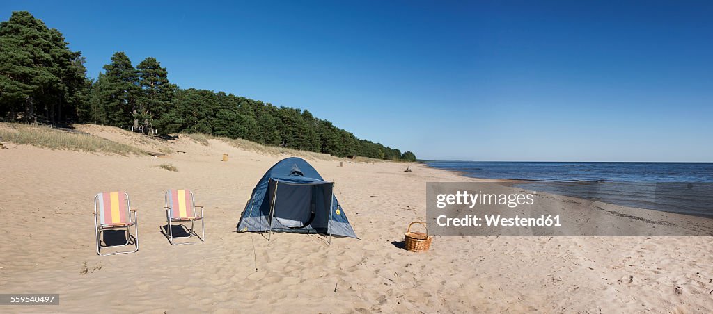 Estonia, two folding chairs and a tent on Kauksi beach at Lake Peipus