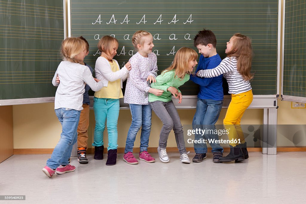 Playful pupils in classroom
