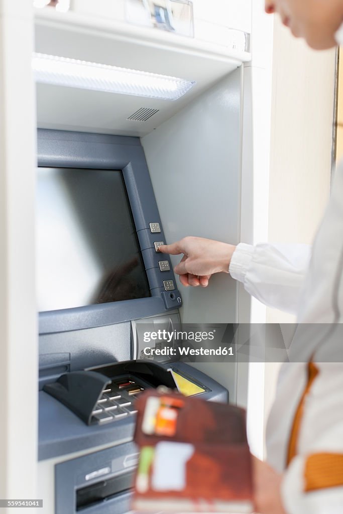 Woman at cash machine