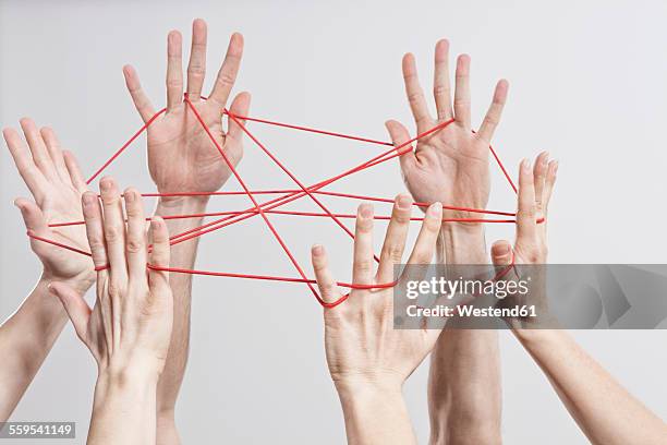 connection, team, teamwork, relationship, hands, cat's cradle - faden hände stock-fotos und bilder