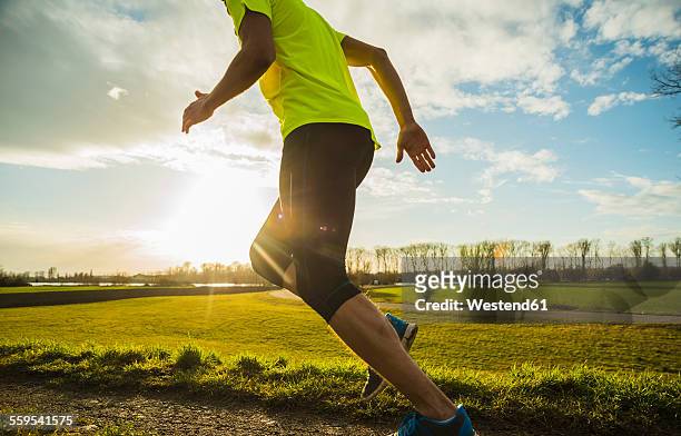 germany, mannheim, young man jogging - running legs ストックフォトと画像