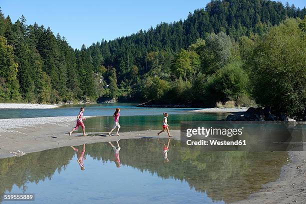 gemany, bavaria, children playing at bank of lech river near ziegelwies - lech stock pictures, royalty-free photos & images