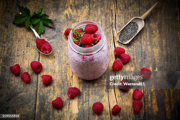 raspberries, chia, milk, kiwi, hemp seed and mint in a glass - hemp milk stock pictures, royalty-free photos & images