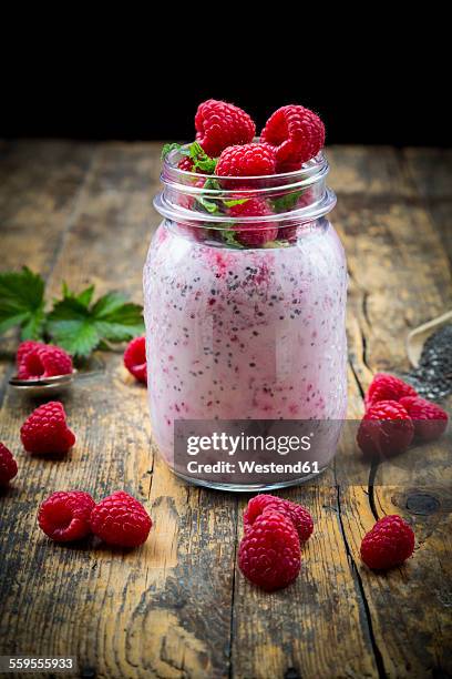 raspberries, chia, milk, kiwi, hemp seed and mint in a glass - hemp milk stock pictures, royalty-free photos & images