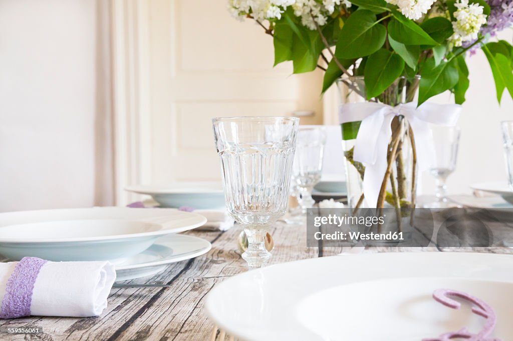 Laid table with lilac