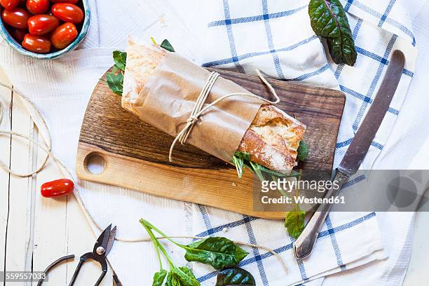 french bread with jamon serrano, cheese, tomatoes and lettuce - sandwich baguette stock pictures, royalty-free photos & images