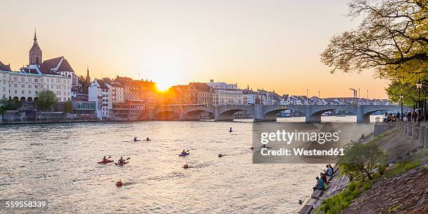 switzerland, basel, city view from the bank of the rhine at dusk - bale photos et images de collection