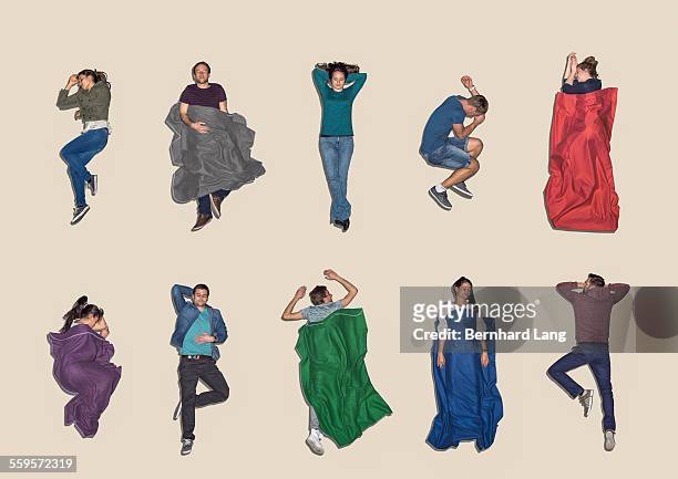 group of people lying down sleeping, aerial view - reclining stock pictures, royalty-free photos & images