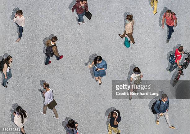 people walking different directions, aerial views - people walking from above stock-fotos und bilder