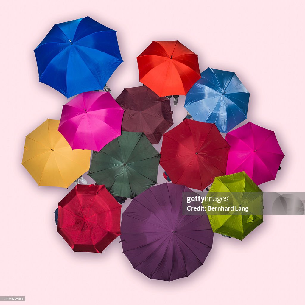 People underneath colored umbrellas, Aerial View