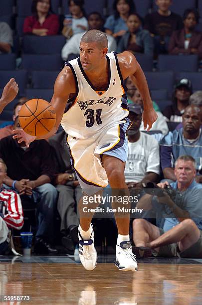 Shane Battier of the Memphis Grizzlies moves the ball up the court during a preseason game against the Chicago Bulls on October 12, 2005 at...