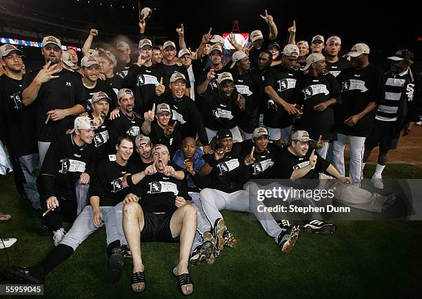 The Chicago White Sox gather on the field for a group photo after they win the American League Pennant by a score of 6-3 against the Los Angeles...