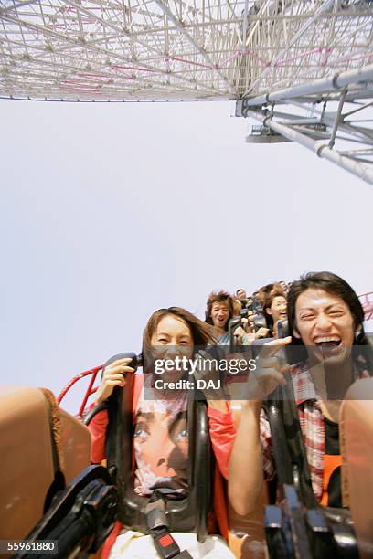 couple - young woman screaming on a rollercoaster stock pictures, royalty-free photos & images