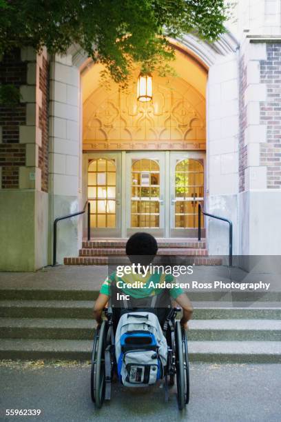 man in wheelchair looking at steps - disabled exclusion stock pictures, royalty-free photos & images