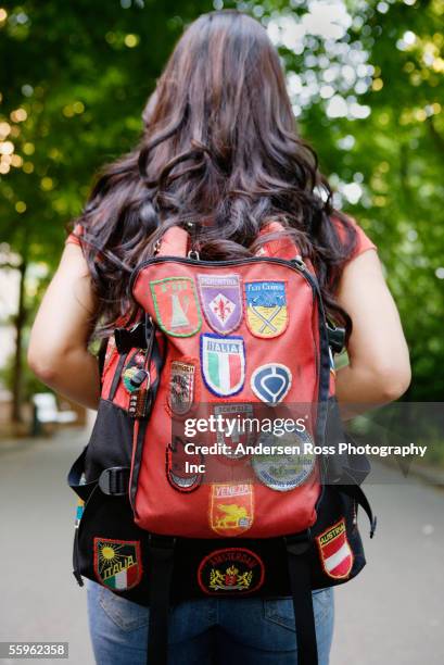 Rear View Of Woman Carrying Backpack High-Res Stock Photo - Getty Images