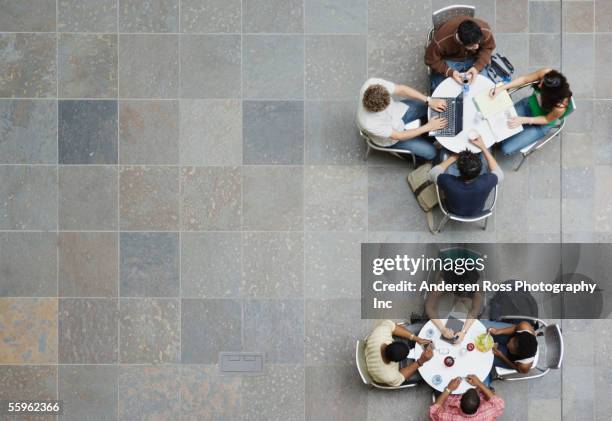 college students sitting at tables - top of head stock pictures, royalty-free photos & images