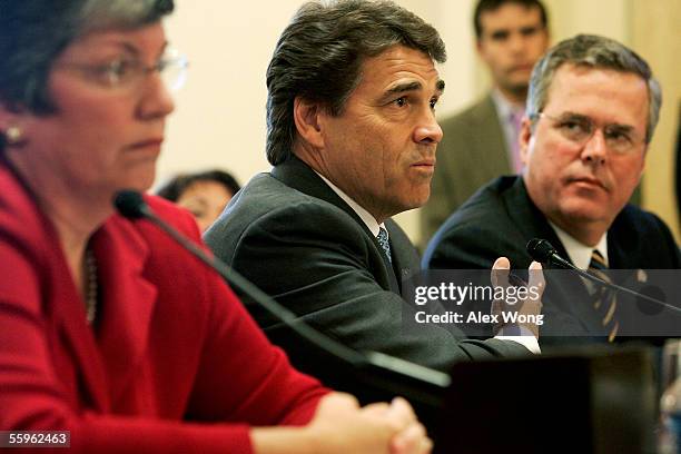 Texas Governor Rick Perry testifies as Florida Governor Jeb Bush and Arizona Governor Janet Napolitano listen during a hearing before the House...