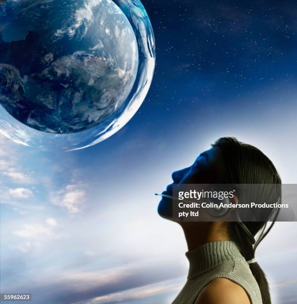 woman gazing at planet - 1 earth productions stock pictures, royalty-free photos & images