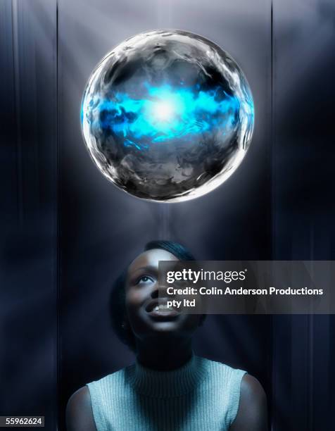 woman looking at globe - 1 earth productions stock pictures, royalty-free photos & images