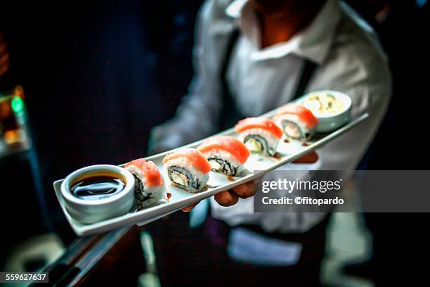 sushi server in a restaurant - sushi stock pictures, royalty-free photos & images