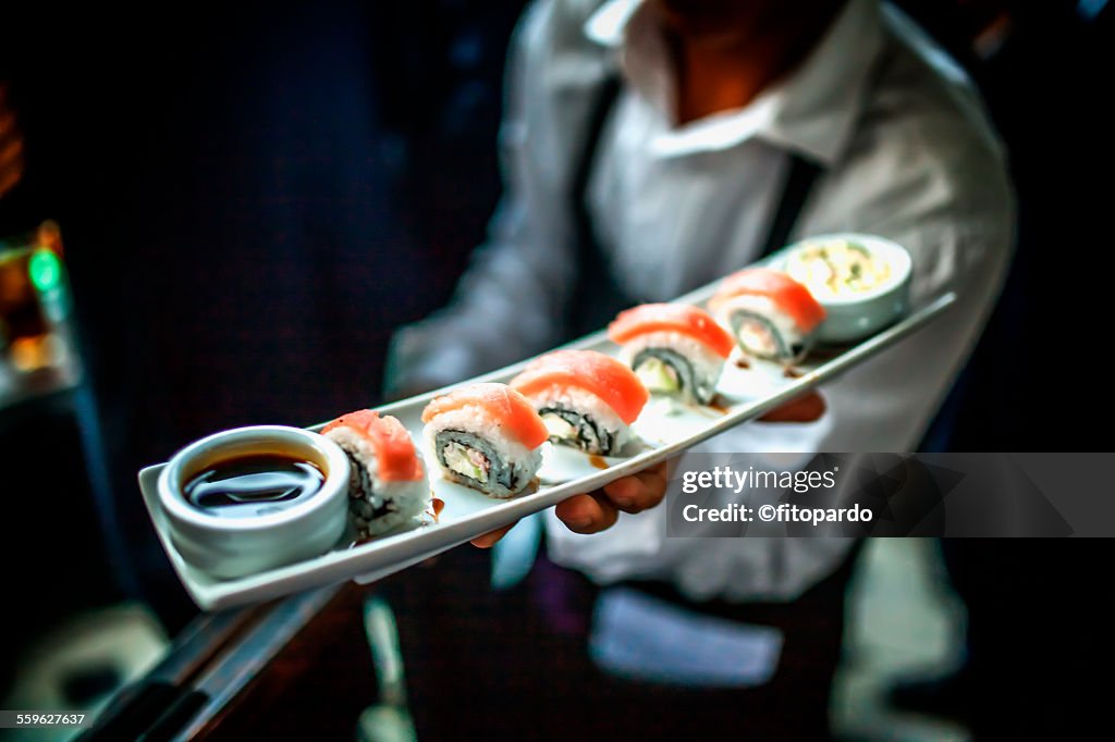 Sushi server in a restaurant