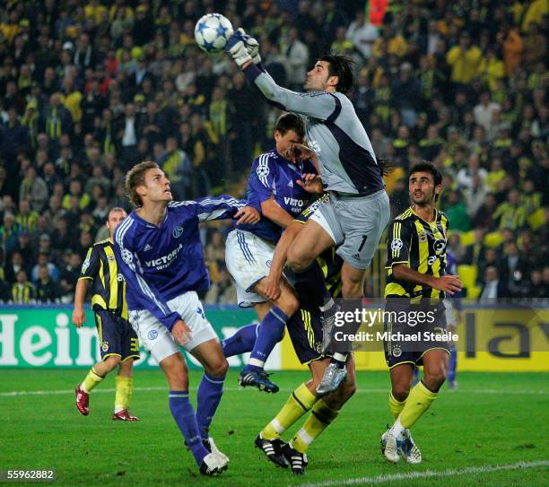 Demirel Volkan, the Fenerbahce goalkeeper, clears from Ebbe Sand and Soren Larsen of Schalke during the Uefa Champions League Group E match between...