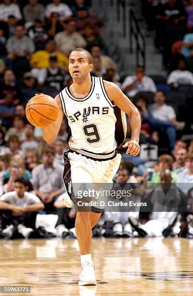 Tony Parker of the San Antonio Spurs brings a ball upcourt in the preseason game against the Houston Rockets at SBC Center on October 15, 2005 in San...