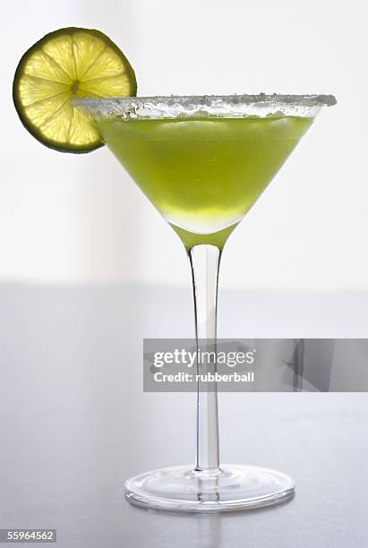 close-up of a glass of martini - tangerine martini stock pictures, royalty-free photos & images
