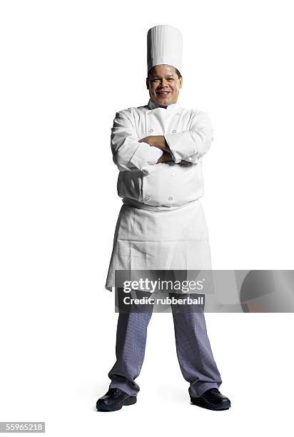 portrait of a male chef standing with his arms folded - chef full length stock pictures, royalty-free photos & images