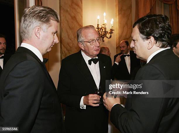 Prince Philippe and King Albert II of Belgium talk with European Commission President Jose Manuel Barroso at a reception at the Cercle Gaulois in...