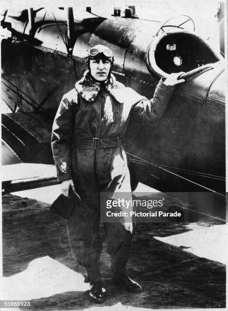 American fighter pilot Eddie Rickenbacker , a commanding officer in the US 94th Aero Pursuit Squadron, poses next to a fighter during World War I,...