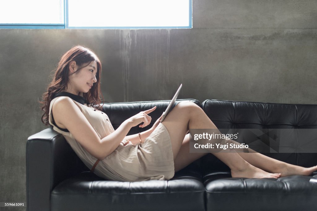 Woman using  digital tablet in casual office