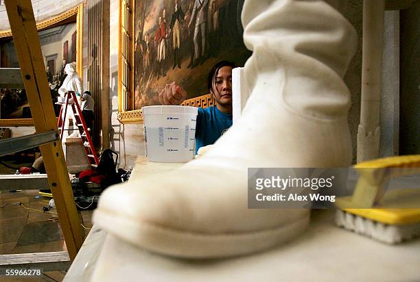 Conservator Sandy Chung of New York City cleans the statue of Civil War General and the 18th President of the United States Ulysses S. Grant inside...