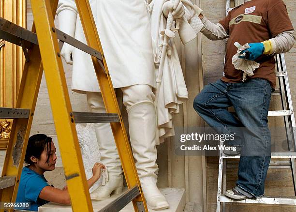 Conservator Sandy Chung of New York City cleans the statue of Civil War General and the 18th President of the United States Ulysses S. Grant inside...