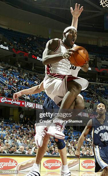 LeBron James of the Cleveland Cavaliers goes to the basket against the Memphis Grizzlies on October 19, 2005 in Cleveland, Ohio. NOTE TO USER: User...