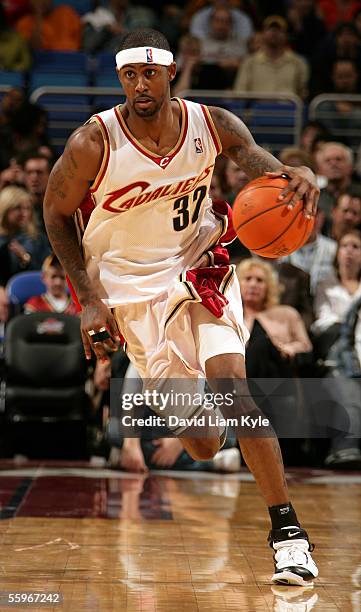 Larry Hughes of the Cleveland Cavaliers dribbles up court against the Memphis Grizzlies during a preseason game at Quicken Loans Arena on October 19,...