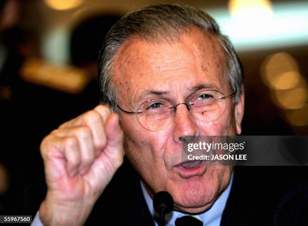 Defense Secretary Donald Rumsfeld speaks during a symposium at the Chinese Academy of Military Science in Beijing 20 October 2005. China needs to...