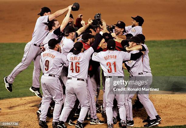 Members of the Houston Astros pile up on each other after they defeated the St. Louis Cardinals 5-1 in Game Six of the National League Championship...