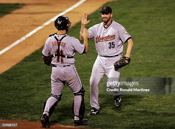Catcher Brad Ausmus and relief pitcher Dan Wheeler of the Houston Astros celebrate their 5-1 win over the St. Louis Cardinals in Game Six of the...