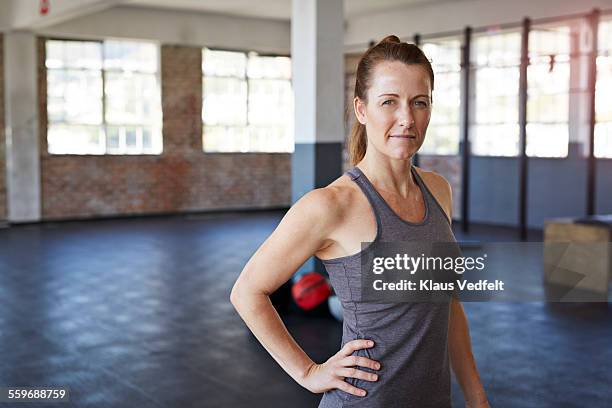 portrait of female gym instructor at gym - gym determination stock pictures, royalty-free photos & images