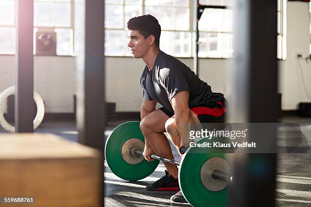 gym instructor lifting barbell at urban gym - deadlift stock pictures, royalty-free photos & images