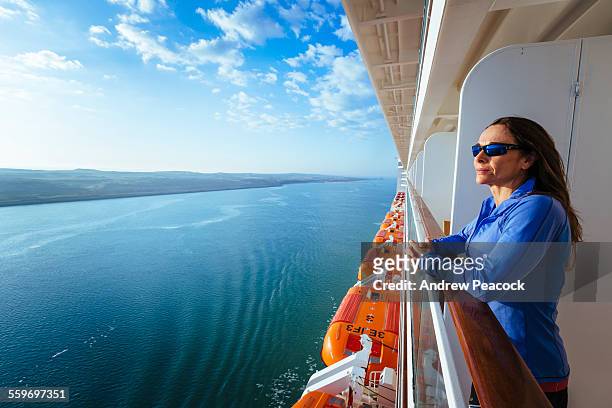 a woman on a ship, suez canal - cruise deck stock-fotos und bilder