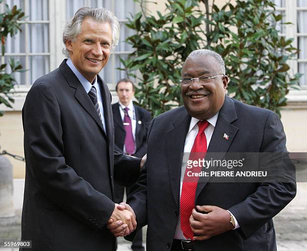 Haitian Prime Minister Gerard Latortue shakes hands with his French counterpart Dominique de Villepin upon his arrival at the Matignon Hotel in Paris...