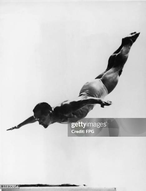 American diving champion Sammy Lee in the air during a dive at the 1952 Olympic Games, Helsinki, Finland, mid 1992.