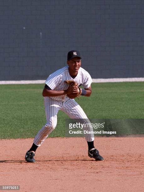 Shortstop Derek Jeter, of the New York Yankees, takes ground balls during Spring Training in March, 1993 at the Yankees' minor league complex in...