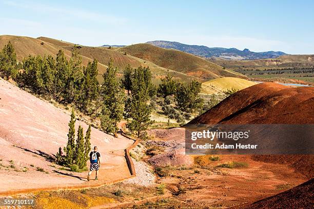 a young man hiking and camping in the outdoors - john day fossil beds national park 個照片及圖片檔